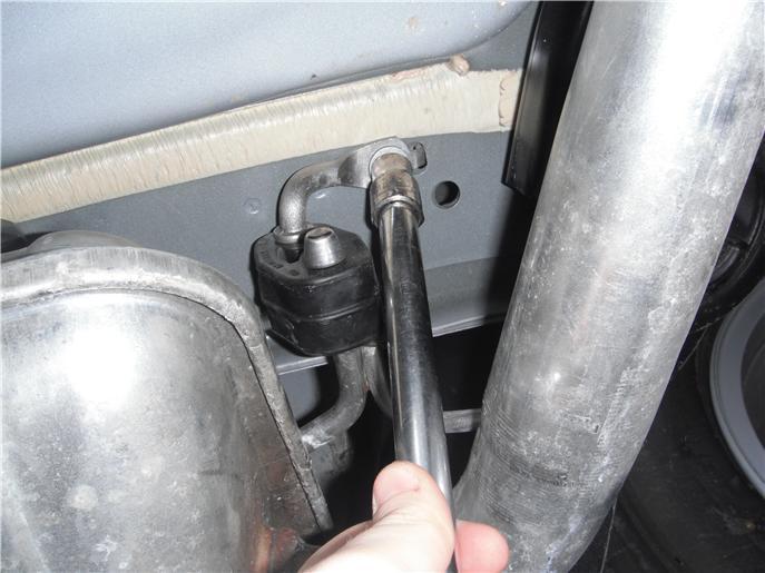 Locate and remove () exhaust isolators near muffler on driver