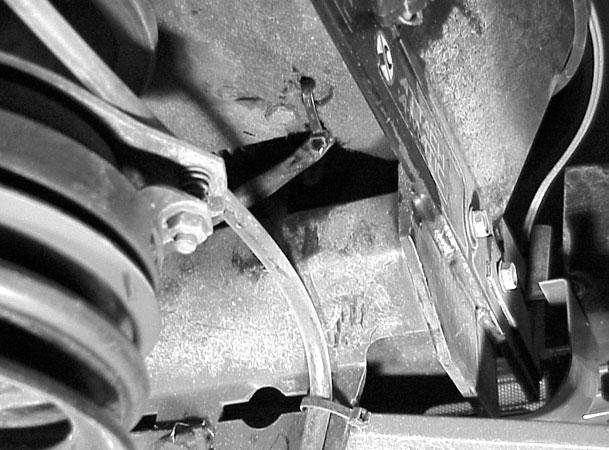 17. Reattach the brake rod return spring, located under the center access plate (Figure 100). 20. Reroute the PTO clutch wire through the frame and tie strap the wire to the frame.