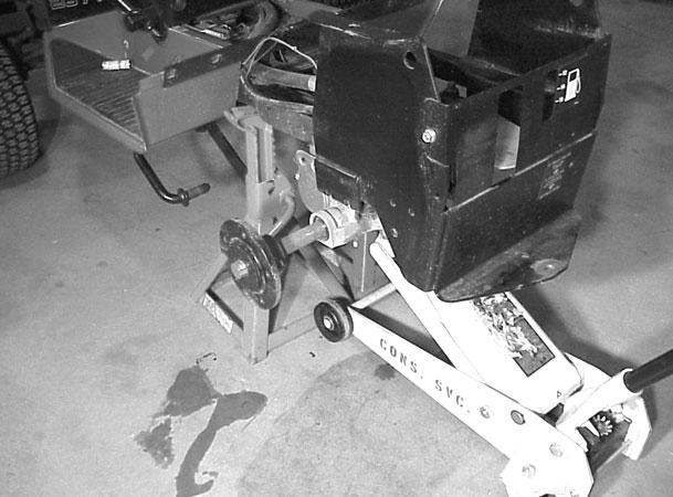 Figure 69 MVC-328X 10. Use a floor jack and put it under the transaxle to help lower the transaxle from the frame (Figure 70). Figure 71 MVC-330X 12.