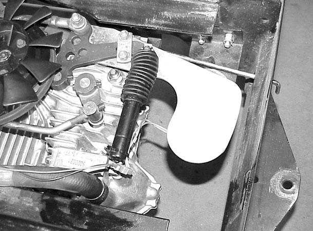 If the tractor has cruise control, reinstall the cruise control magnet bracket and reconnect the plug and jack wiring. Use a tie wrap to tie the wire to the transaxle damper (Figure 82). 11.