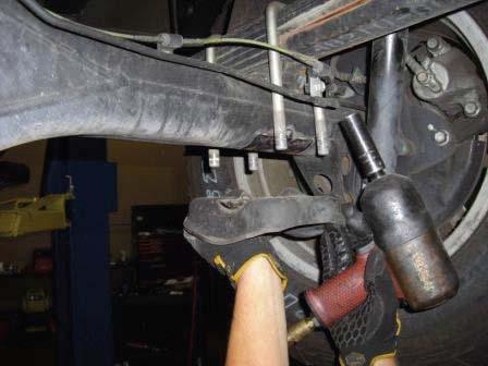 (Fig 31) FIG 32 Remove 2 parking brake brackets from the axle. (Fig 32) Remove the rear shocks.