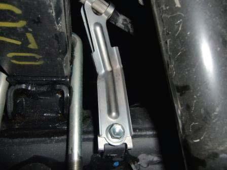 Slightly loosen but do not remove the driver side u-bolts. Remove the passenger side u-bolts completely and discard.