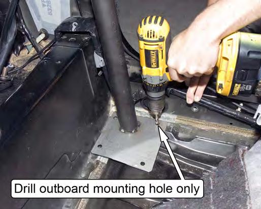 Set the Main Hoop back into place and drill through the forward most, outboard mounting hole on the driver side Main Hoop Mounting Plate using a 3/8" drill bit.