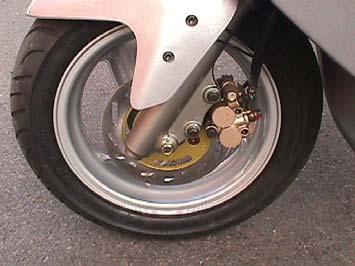 7.5 FRONT BRAKE CHECK If the indicator almost reach the disk, Please ask your dealers to change it. 1.Brake Disk 2.Caliper (brake pad inside) 3.