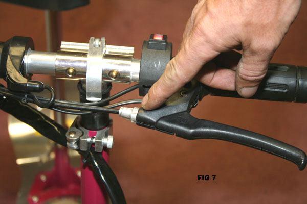 To adjust the rear brakes: For brakes that are adjusted too tight: 1. Loosen the tension screw on the left hand brake lever by rotating it counter-clockwise until the wheel spins freely.