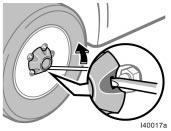 Removing wheel ornament Loosening wheel nuts CAUTION Never use oil or grease on the bolts or nuts. The nuts may loosen and the wheels may fall off, which could cause a serious accident. 3.