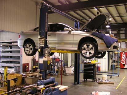 Removal of the Stock Exhaust System: Under the Vehicle Place the vehicle on jacks stands or