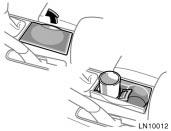Front cup holder CAUTION To reduce the chance of injury in case of an accident or a sudden stop,