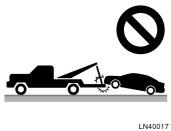 If you cannot shift automatic transmission selector lever (c) Towing with sling type truck (c) Towing with sling type truck NOTICE Do not tow with