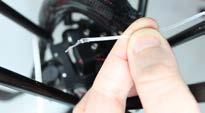 Remove bowden tube from the print head by pushing the black clip downards (with a
