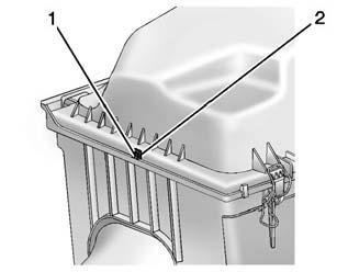 If the filter remains covered with dirt, a new filter is required. Never use compressed air to clean the filter. 1. Air Duct Clamp 2. Electrical Connector 3. Retaining Clips 1. Cover Cut Outs 2.