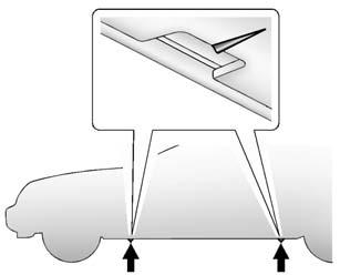 10-74 Vehicle Care 6. Position the jack lift head at the jack location nearest the flat tire. The jacking location is indicated by a V-shaped notch in the plastic molding.