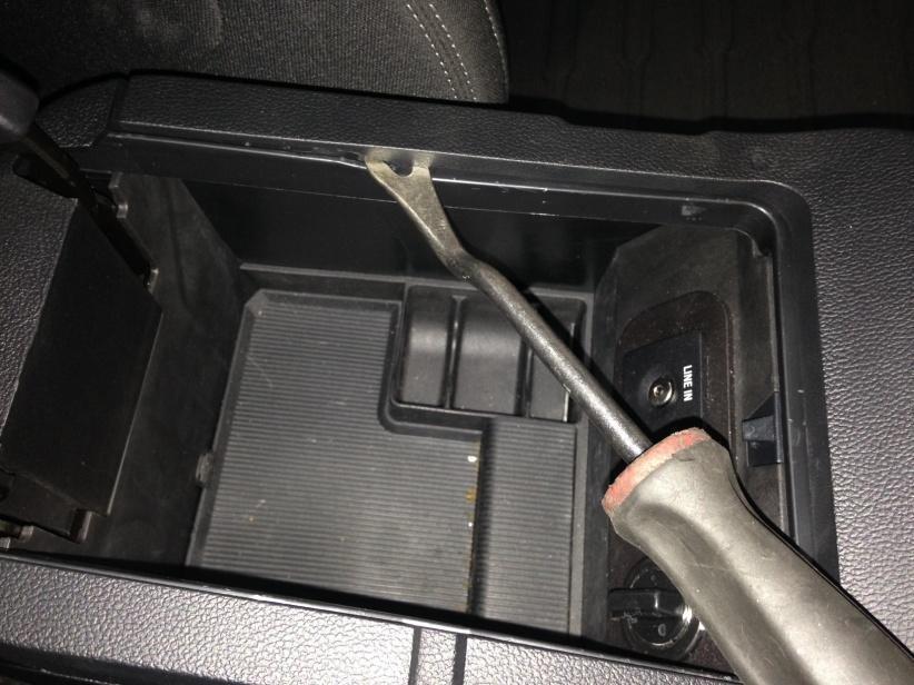 3. Unscrew and remove the shift knob. 4. Lift the parking brake to its highest position. 5.