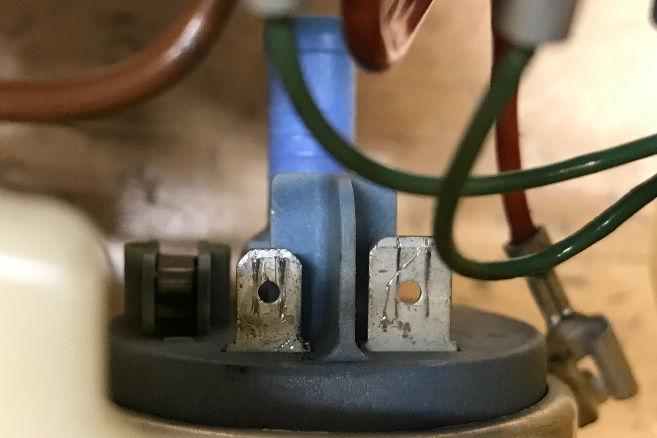 These are visible on the OEM fuel pump terminals, as shown. 12. If the blue insulation were removed on the included male spade terminals, you would also see these same holes. NOTES: 1.