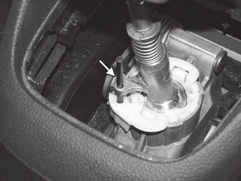 20) Remove the locking pin from the shifter inside the car.