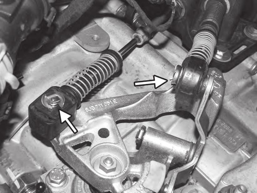 4) Remove the two spring clips holding the shifter cable ends to the shifter selector.