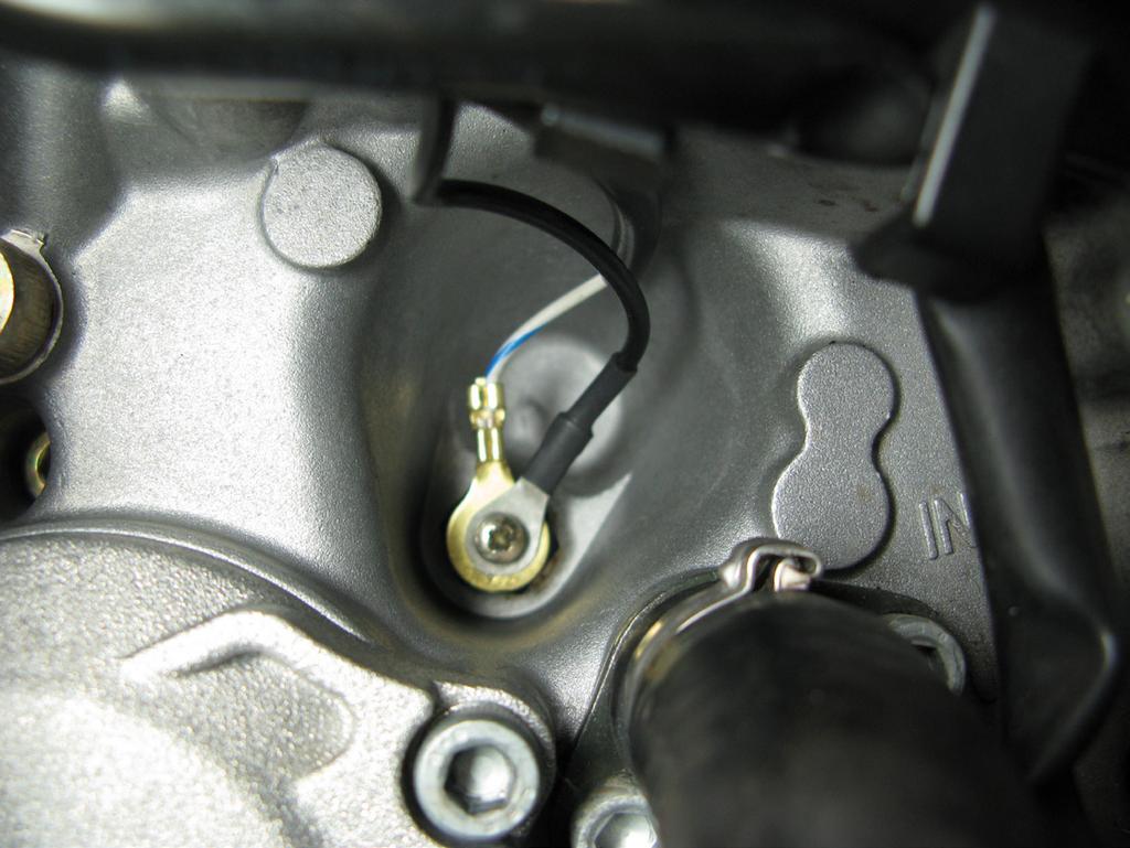 7. Locate the neutral sensor output on the engine found just under the clutch master cylinder.
