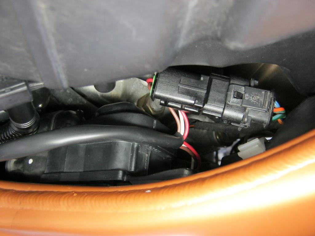13. As previously done with the Bazzaz fuel harness, route the coil harness into the tail and connect it to the control module.