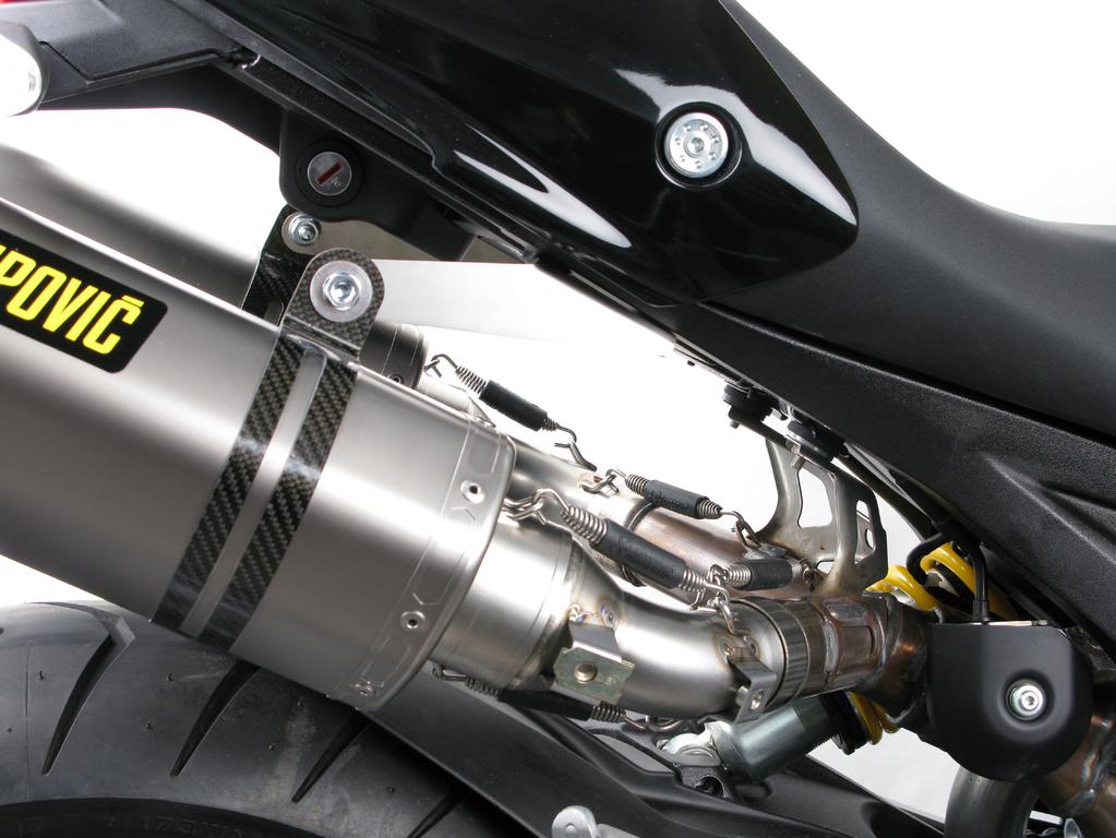 Align the mufflers in respect to the motorcycle.