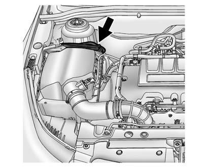 To Use the Heater 1. Turn off the engine. 1.4L Engine Shown, 1.8L Similar 2. Open the hood and unwrap the electrical cord.