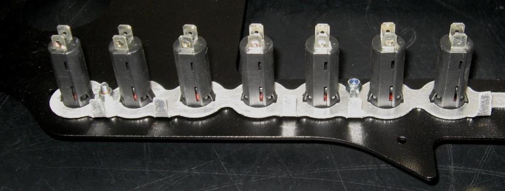 Each 2-way switch is labelled on one side with the direction of the OFF and ON positions.