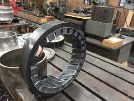 The stator lamination stack assembly is thermally fit into the housing and the coils are inserted into the stator slots. After insertion, the coil leads were welded to the routing phase wire.