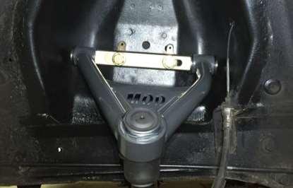 Figure 10 Upper control arm installed in vehicle. Note: Front of vehicle is on left side of the page 5. If not already installed, fasten the zerk fitting to the top of the upper ball joint. 6.