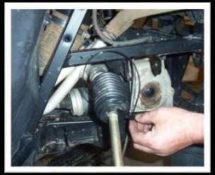 15. Pull boot back over the ball joint and steering stop and