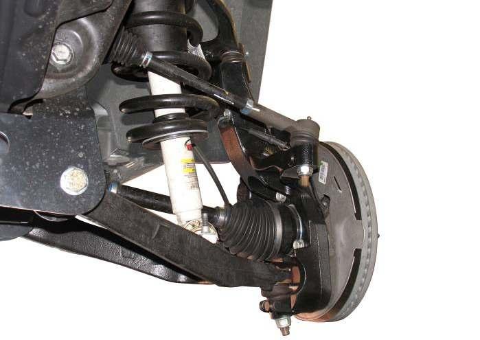 ABS Wire 2) Loosely attach new Rancho shock absorber with OE hardware, or shock spacer and OE shock assembly using hardware supplied in kit RS860746, to upper shock mount.