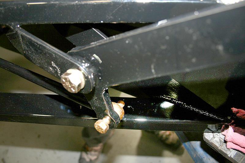 Install the hardware with the heim joint on the outboard side of the pedal arm. Leave the jam nut loose.