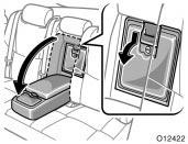 In case the trunk opener is not actuated Luggage security system 1. Pull down the rear armrest and open the door behind it.