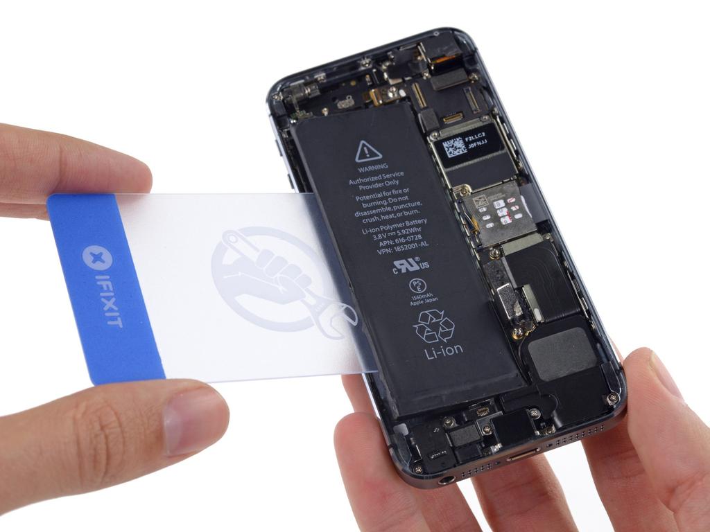 Step 28 Flip the iphone back over and insert a plastic card between the case side of the battery and the rear case. Do not pry against the logic board or you may damage the phone.