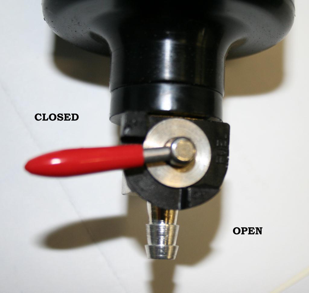 To drain the oil catch can turn the lever to the open position. This catch can, should be drained ever oil change.