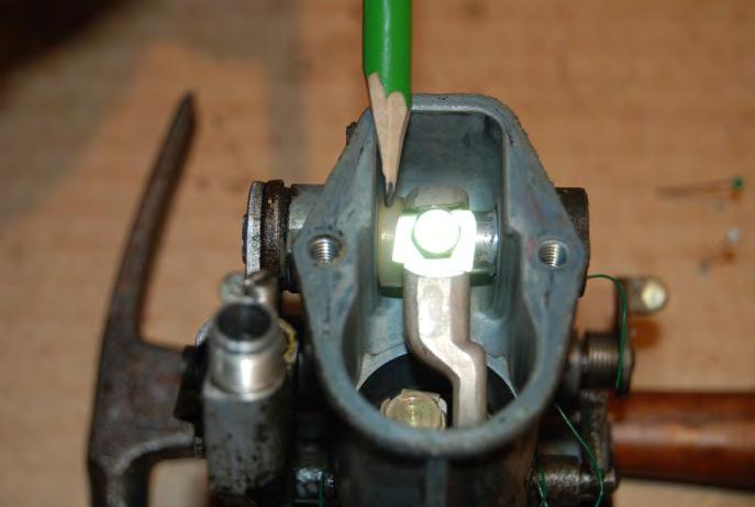 21. In the next few steps, you will be removing the link arm that operates the throttle