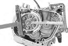 3-17 ENGINE CLUTCH With the primary drive gear held immovable using the special