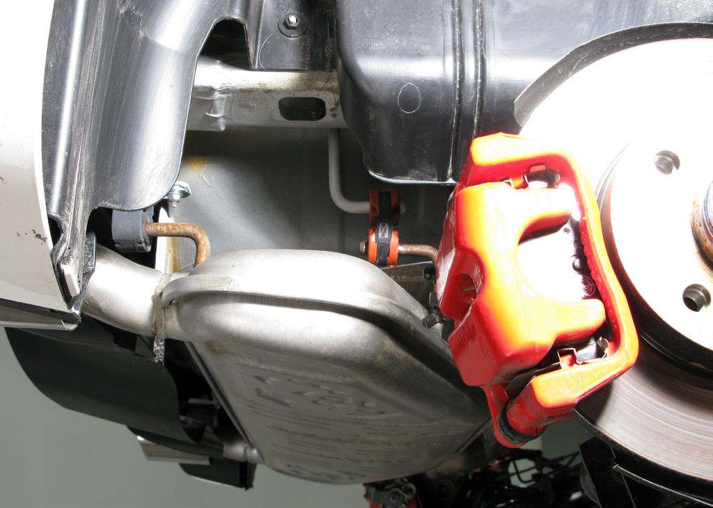 2. Carefully pull the rubber brackets off the muffler s brackets, using flat pry bar and remove the original muffler off the vehicle (Figure 2, 3).