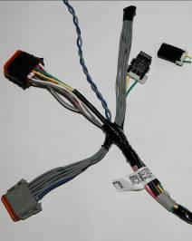 Connect the J1939 Terminating Resistor to the 2-pin connector on the AWARE harness located near the AWARE module, next to the two module connectors.