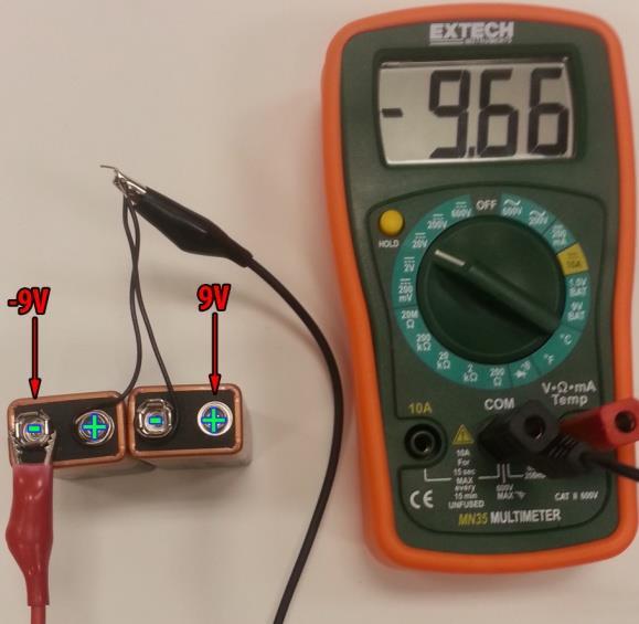 Connect the multimeter to verify the output voltage on each side. D. Figure 11B shows a reading of a negative voltage. E.