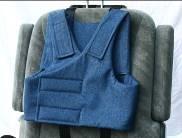 Wrap the right side of the vest around the occupant (Figure