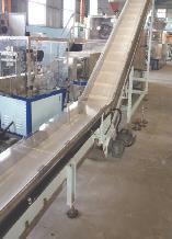 The conveyor has measures to prevent soap noodles from falling out the conveyor.