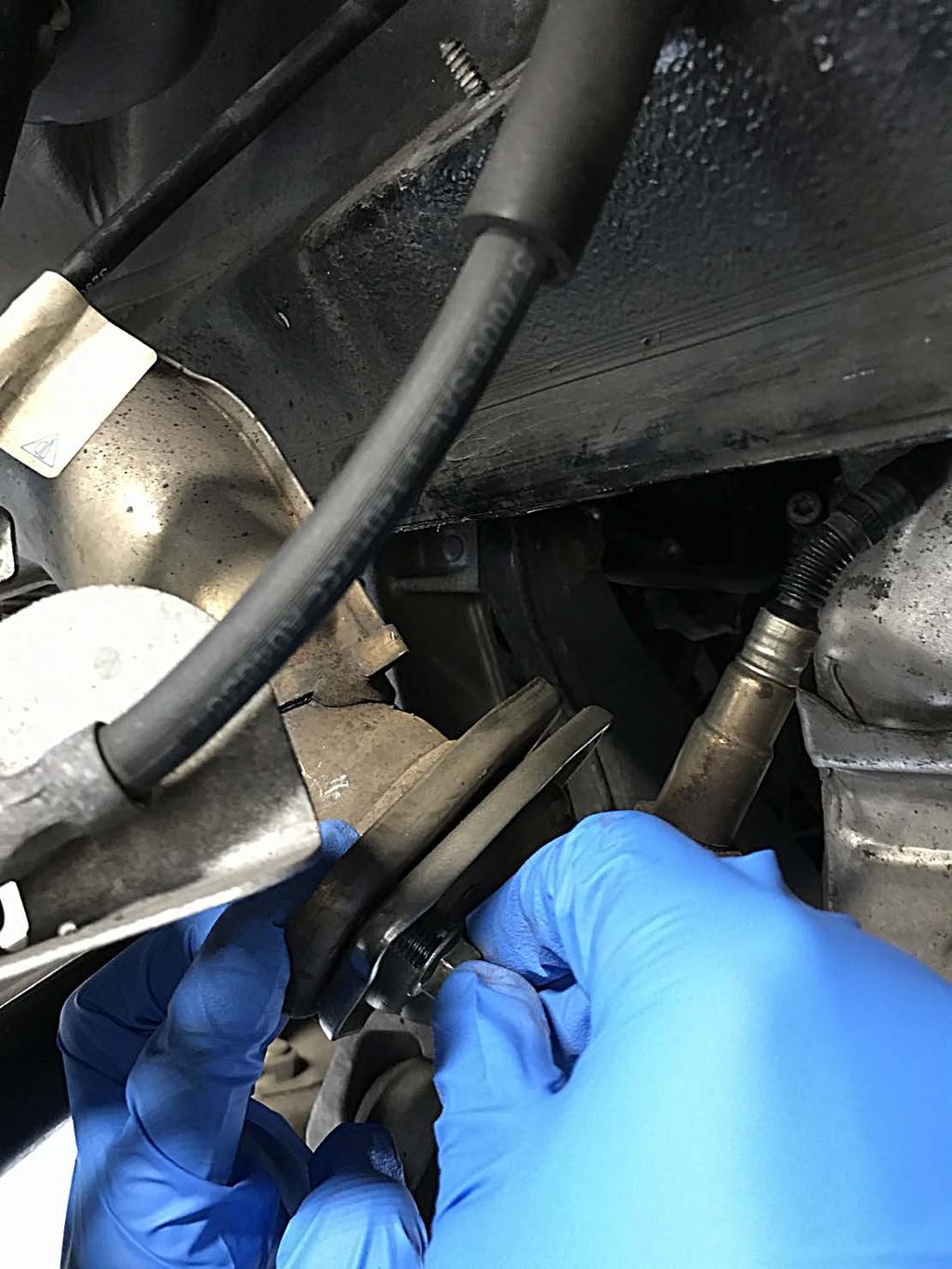 Pictured Above: Remove factory mounting hardware from the header / muffler flanges