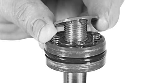 SERVICING THREE PISTON SYSTEM Remove the washer. Slide the tilt piston off the rod. Be careful not to lose the springs, plungers, or small check valves in the piston assembly.