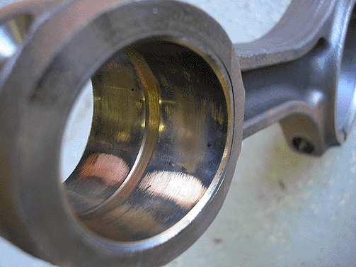 Page 6 of 13 Piston pin bore will show signs of scoring, the wrist pins will be discolored, and can have oil