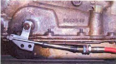11. Install the transmission shift lever so that the round end is closest to the front of the vehicle. Add the washer and the nut to hold it in place. 12.