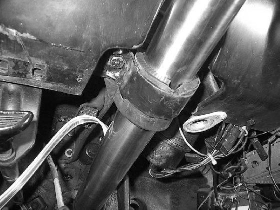 12. To install the new steering column it is necessary to use the stock column clamp and insert the supplied rubber isolator.