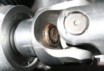 Before doing so make sure the lower u-joint is lined up so that one setscrew will spot notch align with the flat section on the rack's pinion shaft (Fig 12A) and the other setscrew will seat in the