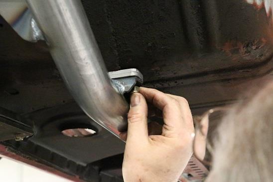 by 1¼ inch). Install the four 5/16 Nylock nuts (two per side) and tighten securely.