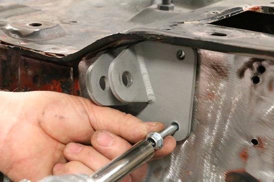 Install the four 5/16 self-tapping screws through the bracket into the firewall.
