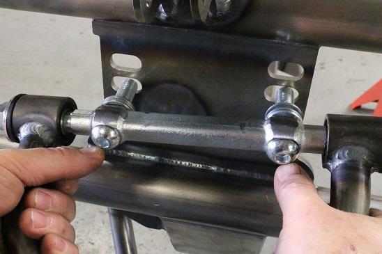 Install the upper control arms with the ball joint facing down.