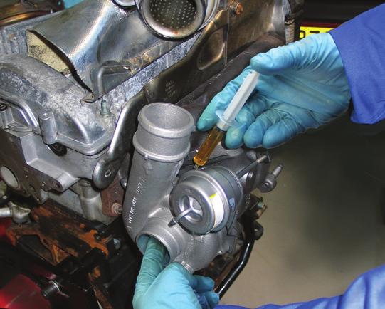 4. Connect the oil drain pipe. Prime the turbo by filling the oil feed hole with clean engine oil, using the oil-filled injector from the FitKit supplied with your BTN turbo.